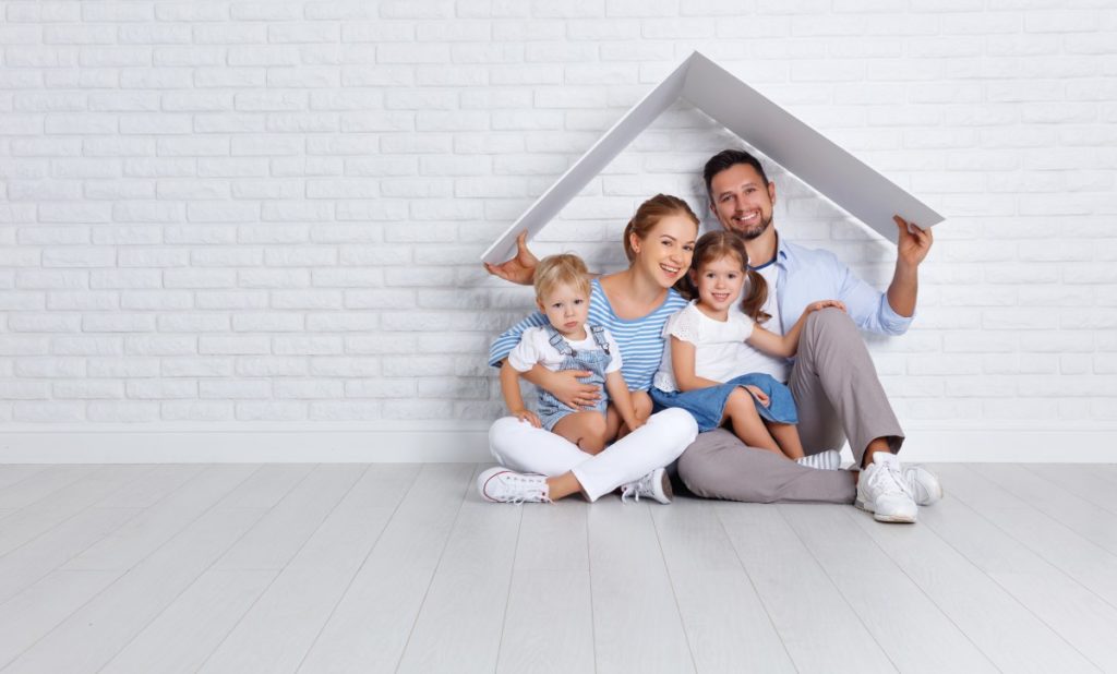 concept housing a young family. mother father and children in new home